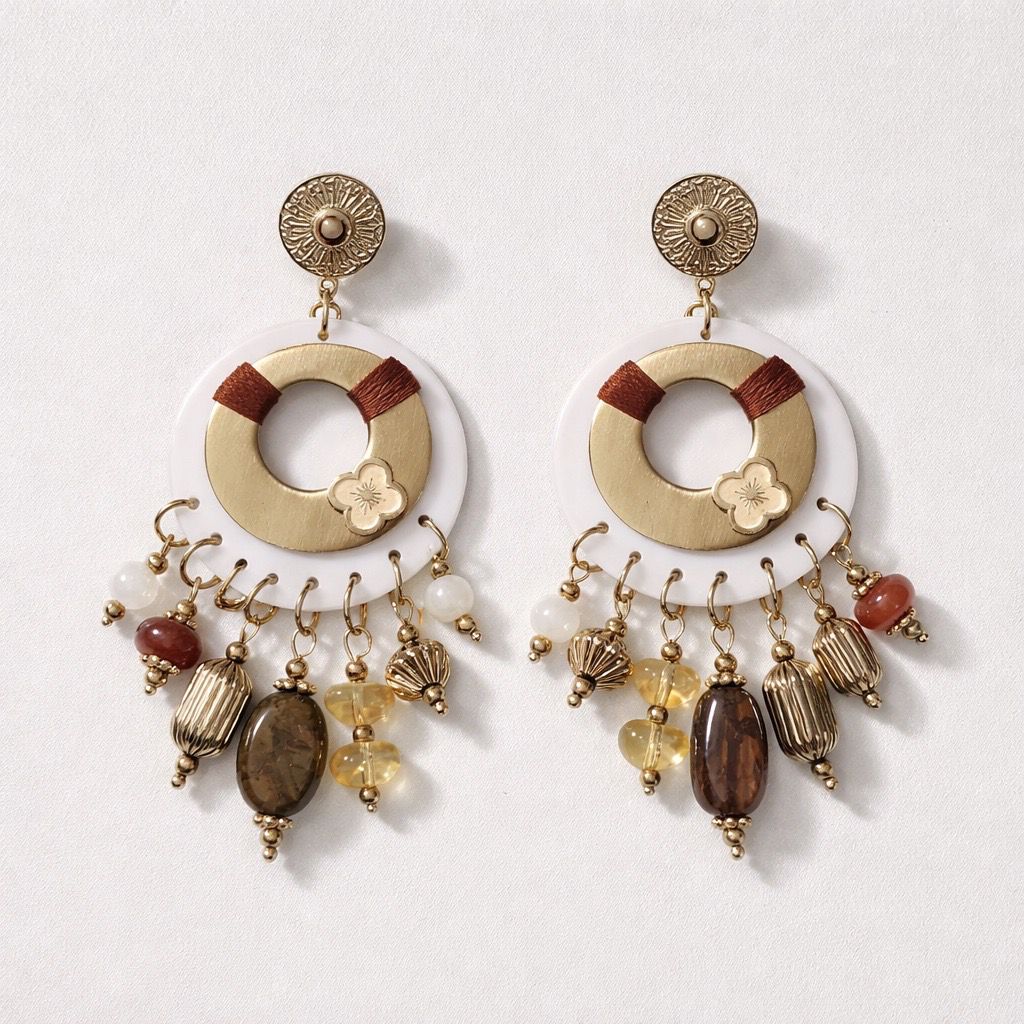Orecchini pendenti con charms