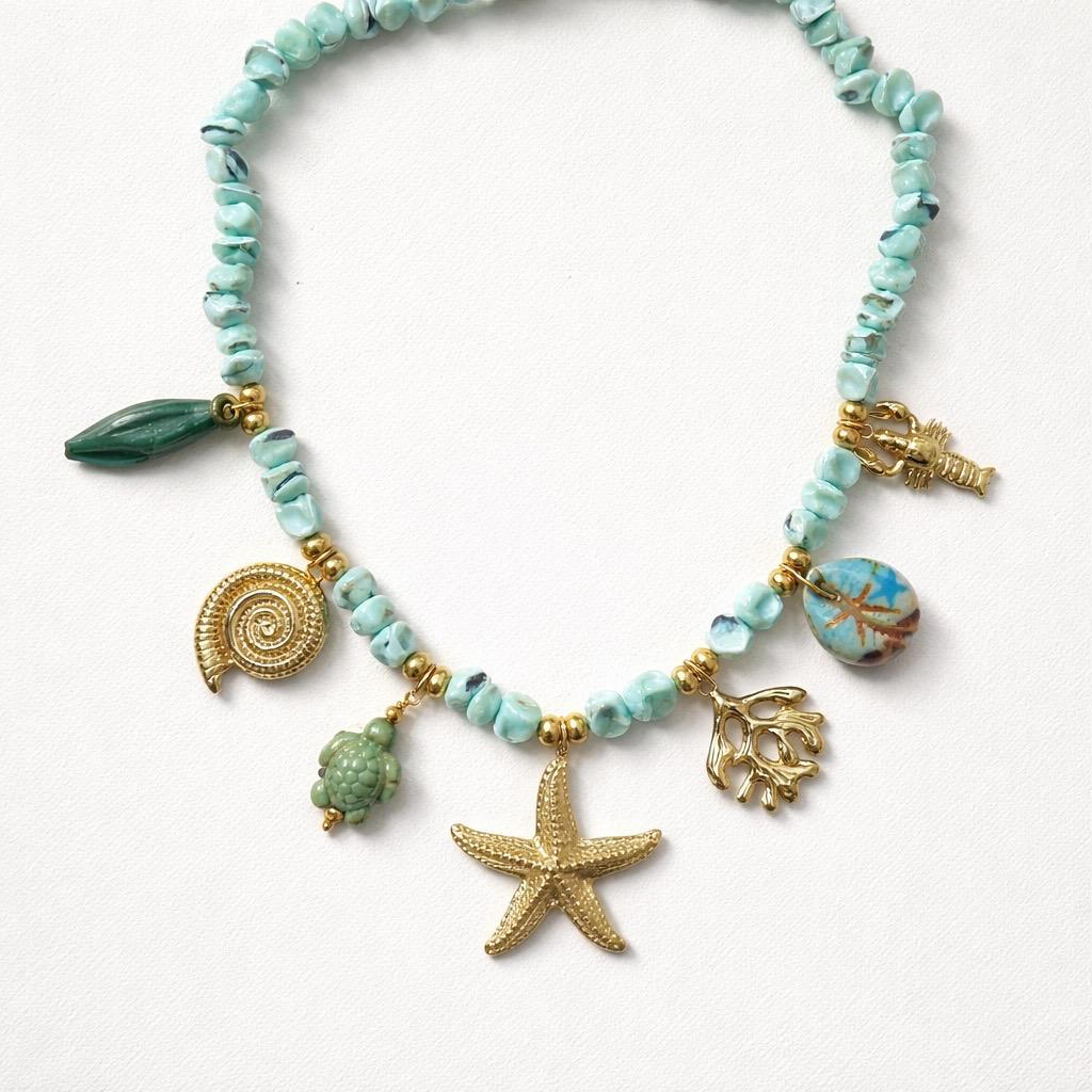 Collana regolabile con stella marina e charms