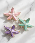 Pinza fermacapelli stella marina smaltata 7cm 6pz assortiti