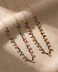 Collana regolabile acciaio mini charms vetro e pietra