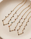 Collana regolabile acciaio onde gocce pietra e strass
